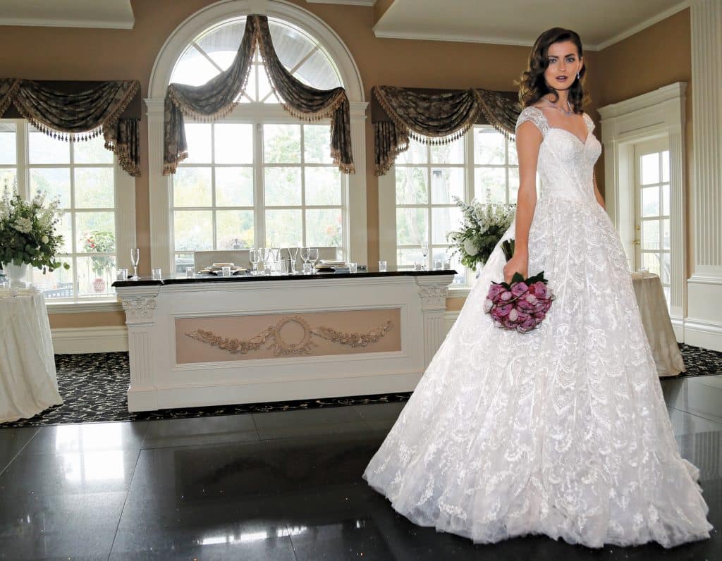Gown: Oleg Cassini at David's Bridal (CWG766, $1,958), Ariston Flowers