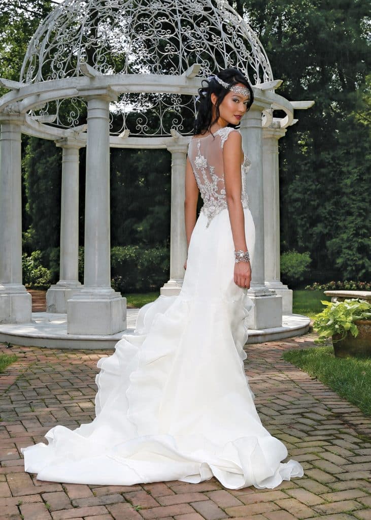 Gown: Eve of Milady (4322, $4,200). Flora Design