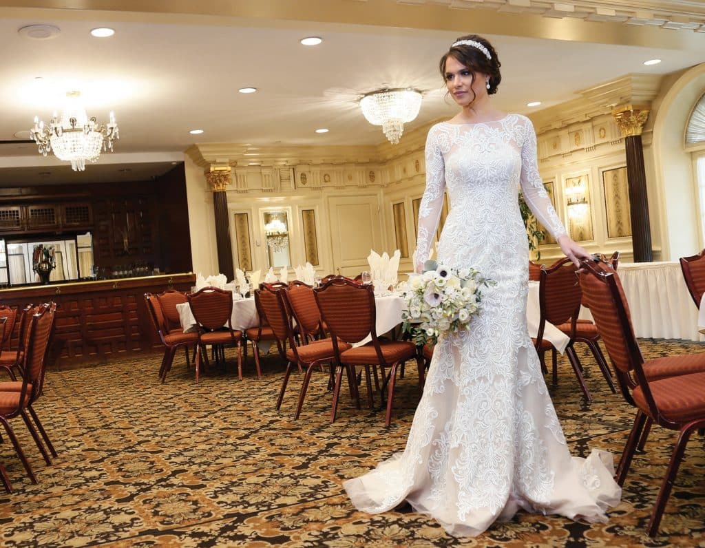 Gown: Oleg Cassini at David’s Bridal(CWG670, $1,450)