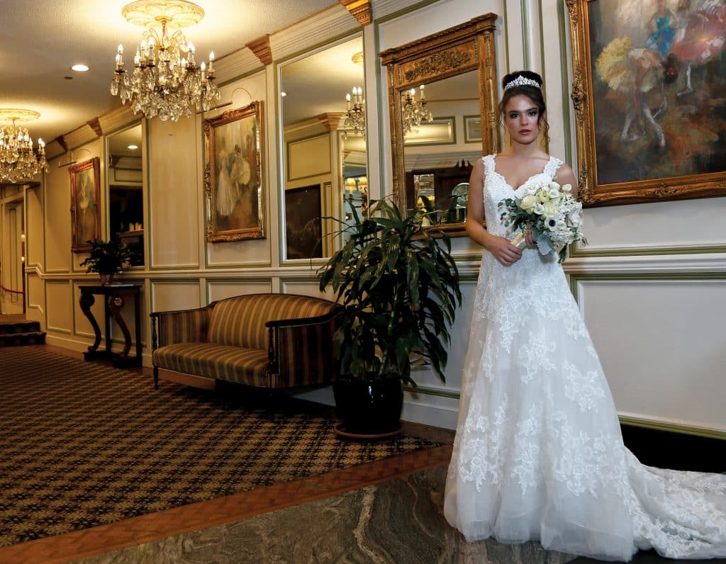 Gown: Oleg Cassini at David’s Bridal (CWG672, $1,450)