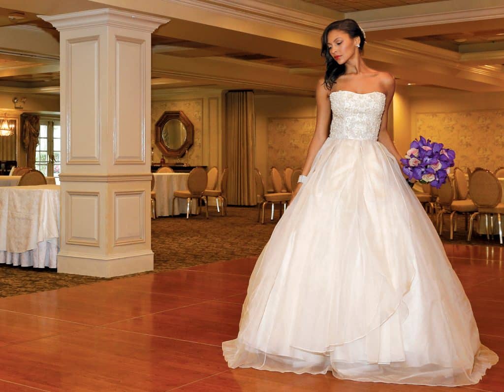 Gown: Lucia Rodriguez (LW1945, $5,500). Bouquet: Ariston Flowers