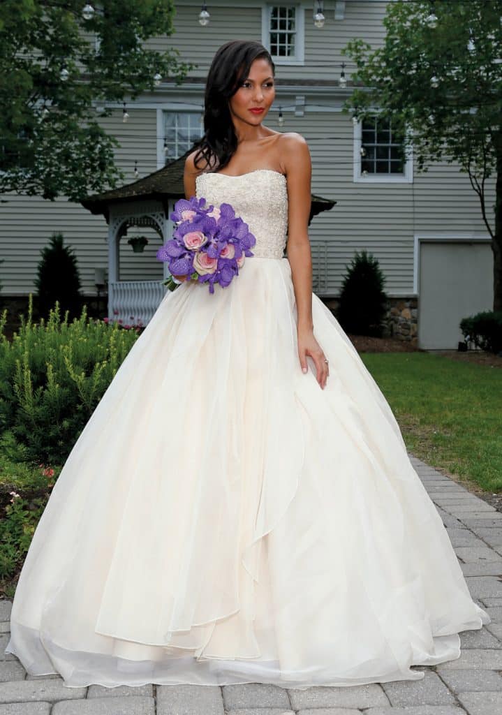Gown: Lucia Rodriguez (LW1945, $5,500). Bouquet: Ariston Flowers