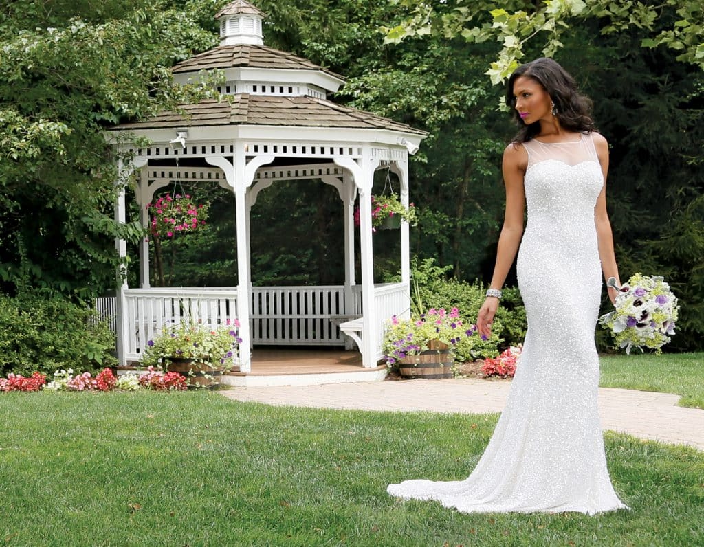 Gown: Belluccio (Melissa Fedele, $2,000) at Designer Loft. Bouquet: KC Events
