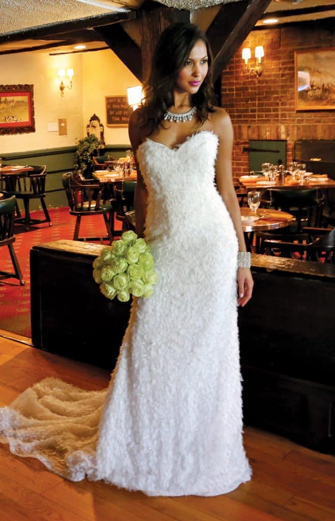 Gown: Lucia Rodriguez (LW1947, $7,200). Bouquet: Ariston Flowers
