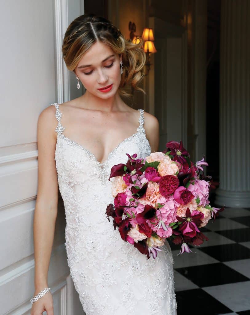 Bouquet: PMK Floral Arts. Gown: Eve of Milady (4349, $6250)
