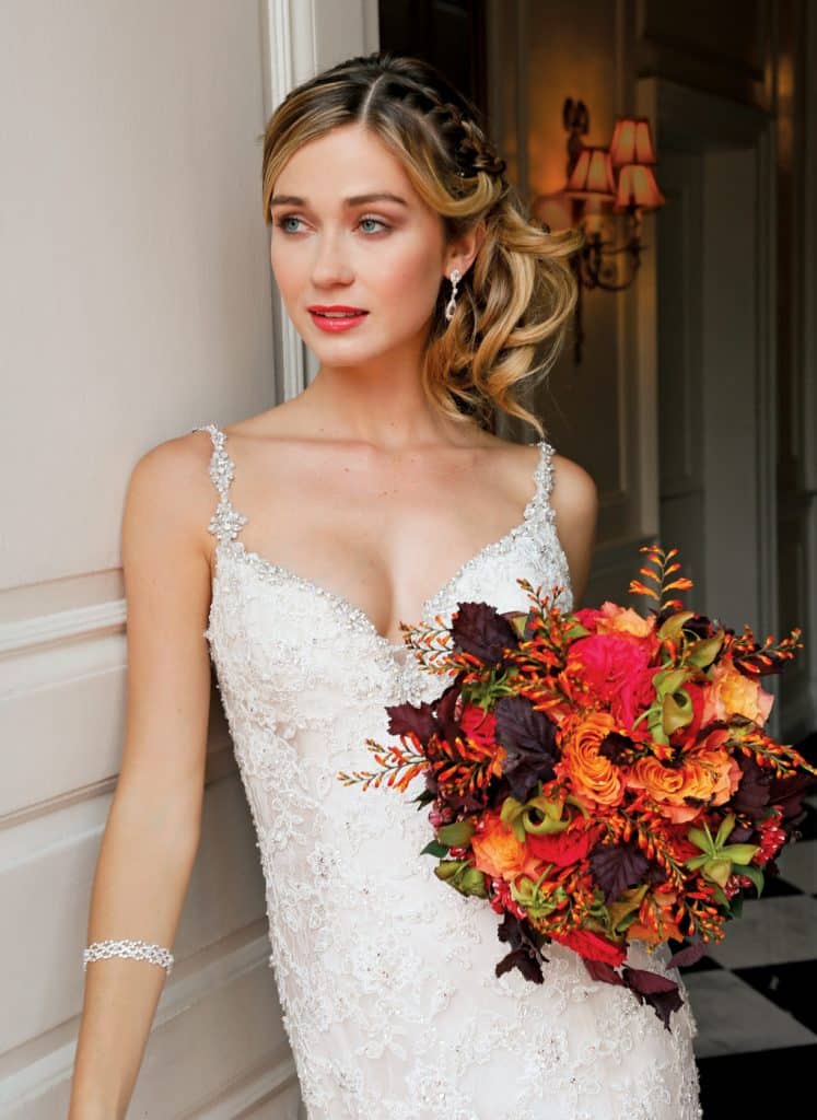 Bouquet: PMK Floral Arts. Gown: Eve of Milady (4349, $6250)