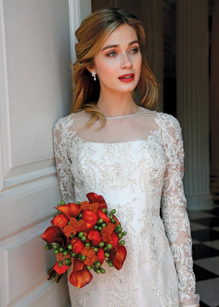Bouquet: Sandra's & Donath's Florist. Gown: Lucia Rodriguez (LW4672, $7400)