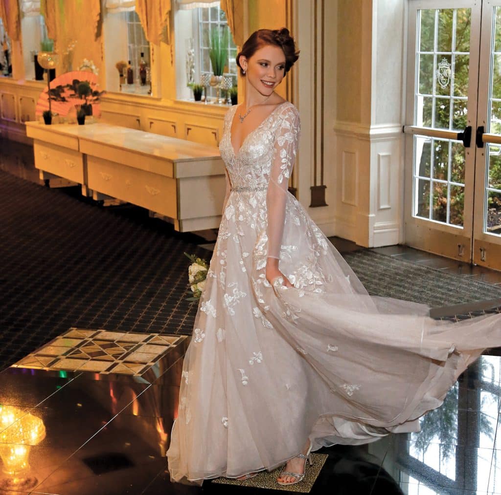 Gown: Galina Signature at David's Bridal (SWG820, $1158). Henry's Florist