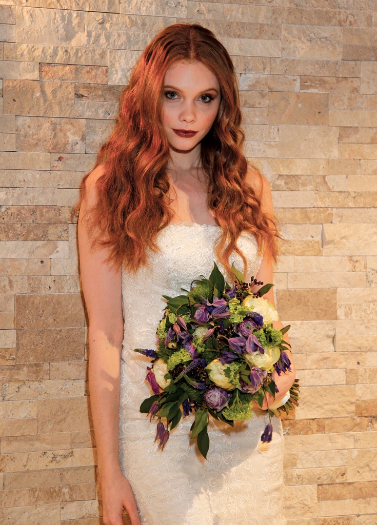 Gown: Oleg Cassini at David's Bridal (CWG812, $1458). Bouquet: Mitch Kolby Events