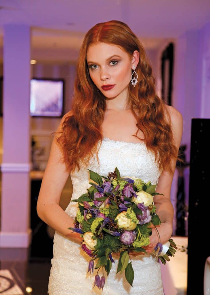 Gown: Oleg Cassini at David's Bridal (CWG812, $1458). Bouquet: Mitch Kolby Events