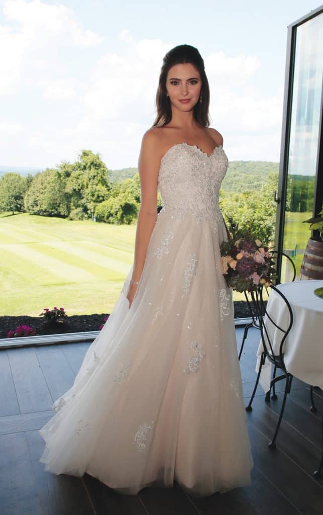 Gown: Bossina Signature (BC637) at Bossina Couture. Hair Jewelry: Ciro's Hair Pavilion. Bouquet: Mitch Kolby Events.