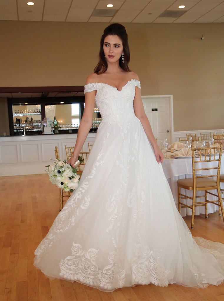 Gown: Bossina Signature (BC637) at Bossina Couture. Hair Jewelry: Ciro's Hair Pavilion. Bouquet: Mitch Kolby Events.