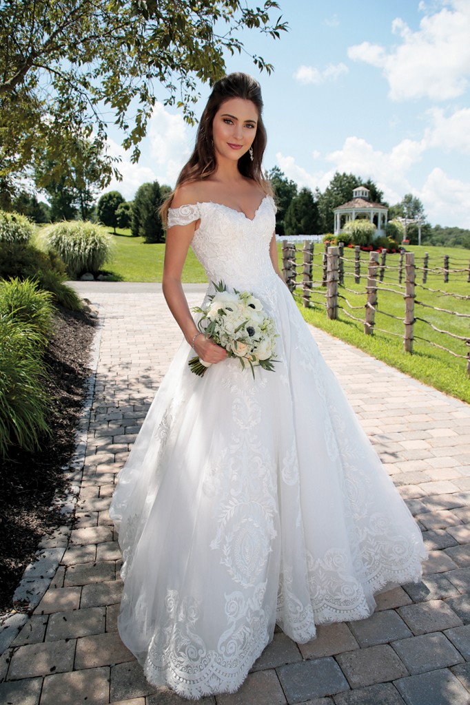 Gown: Bossina Signature (BC637) at Bossina Couture. Hair Jewelry: Ciro's Hair Pavilion. Bouquet: Mitch Kolby Events.