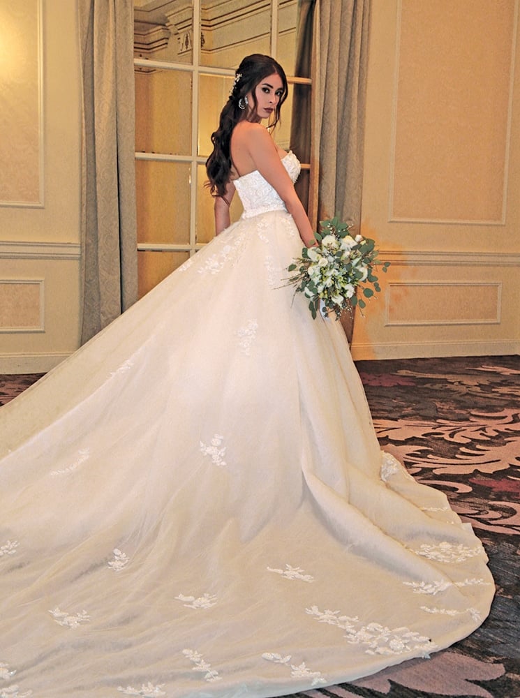Gown: Dovita Bridal (Florida, $2500; train $500) at Bossina Couture. Bouquet: Douglas Koch Designs Ltd.