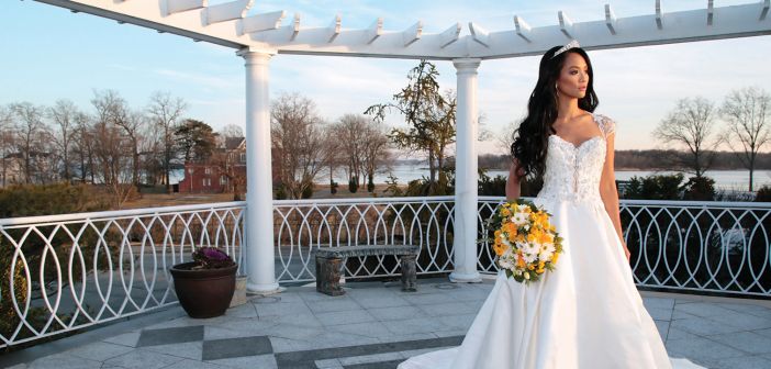 Gown: Eve of Milady (1639). Bouquet: Henry's Florist Floral Decorators.