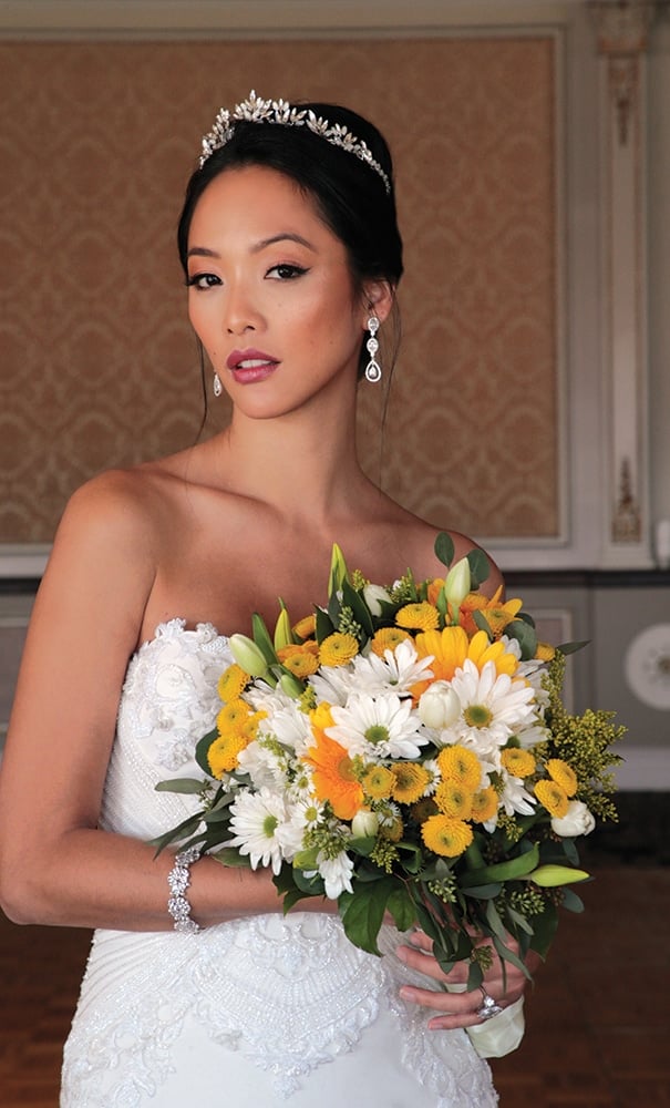 Gown: Jude Jowilson (Astor). Bouquet: Henry's Florist Floral Decorators.