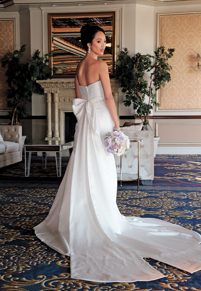Gown: Jude Jowilson (Kelly). Bouquet: Forever Brooch Bouquets.