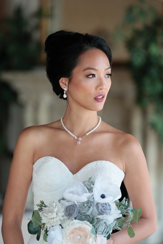 Gown: Jude Jowilson (Swanson). Bouquet: Forever Brooch Bouquets.