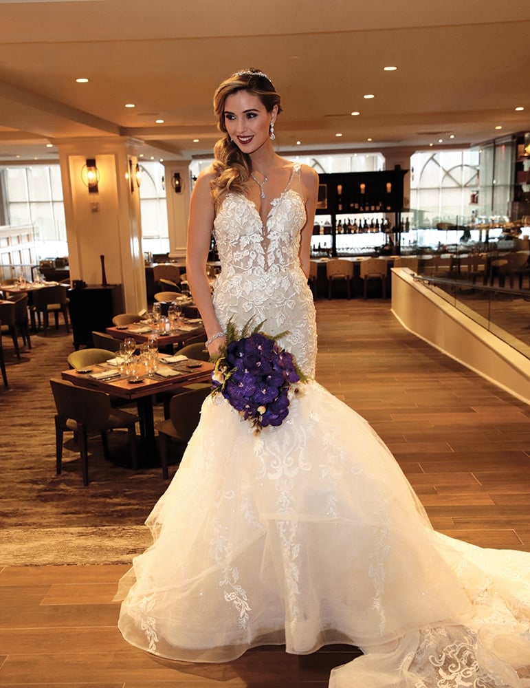 Gown: Eve of Milady (1649). Bouquet: Ariston Flowers.