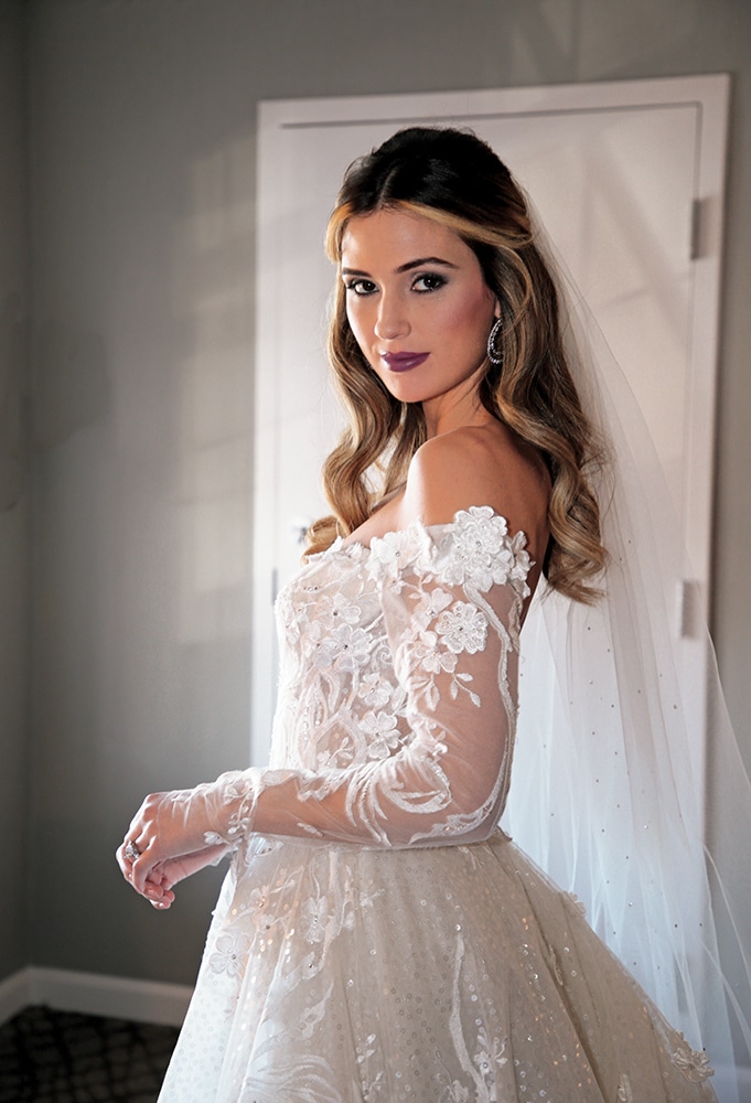 Gown: Eve of Milady (4388). Bouquet: Ariston Flowers.