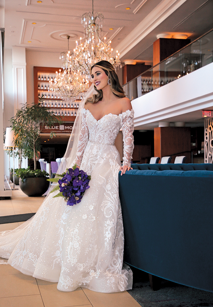 Gown: Eve of Milady (4388). Bouquet: Ariston Flowers.