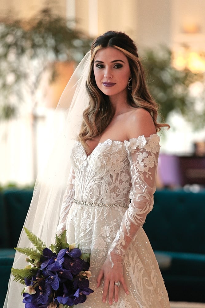Gown: Eve of Milady (4388). Bouquet: Ariston Flowers.
