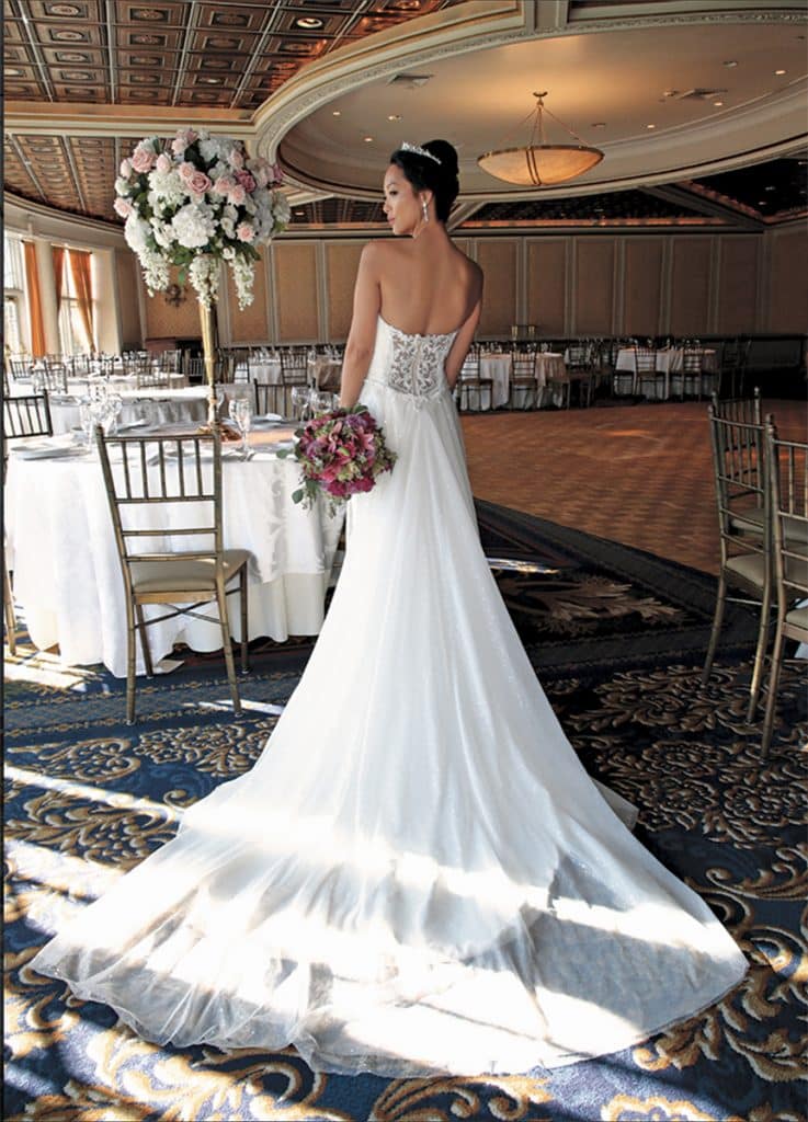 Gown: Jude Jowilson (Astor). Bouquet: Henry's Florist Floral Decorators.
