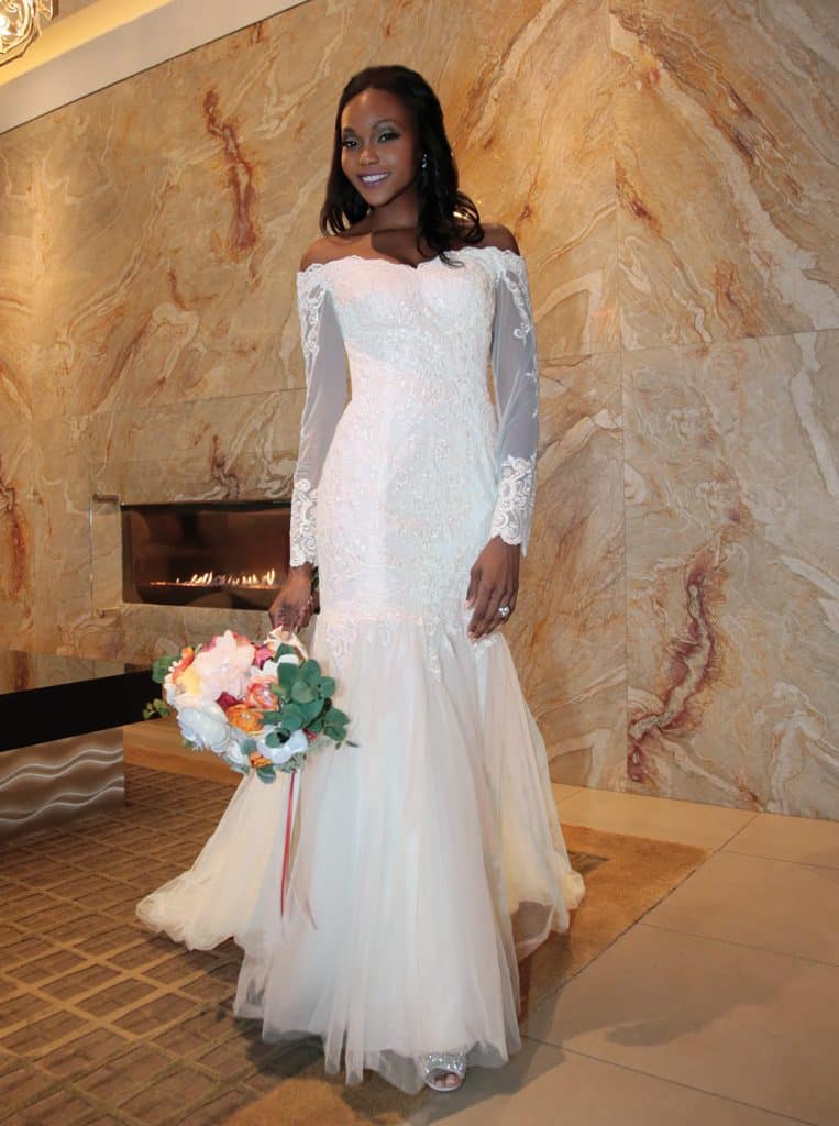 Gown: David's Bridal (WG3943, $649). Bouquet: Forever Brooch Bouquets.