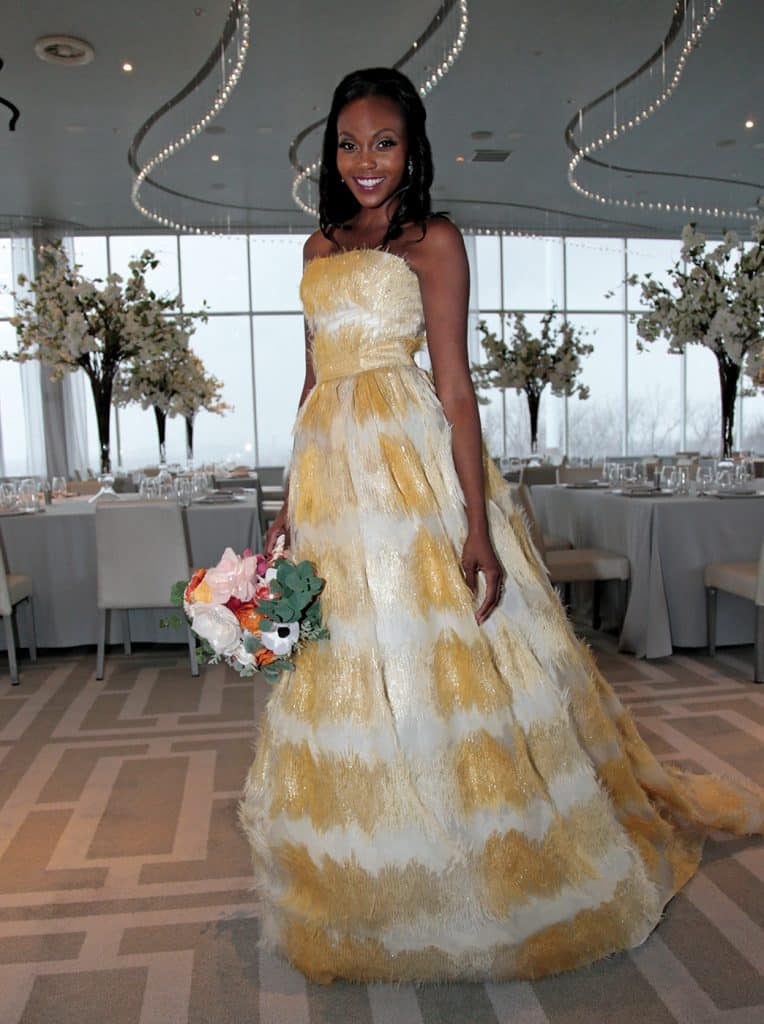 Gown: Lucia Rodriguez (LE92000, $5800). Bouquet: Forever Brooch Bouquets.